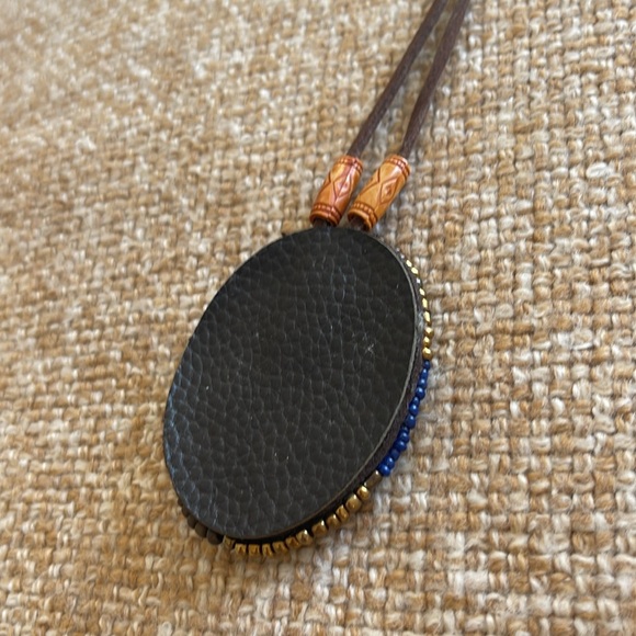 FLASH SALE! $5 Ceramic pendant surrounded by beads on a leather strap. - Picture 3 of 3